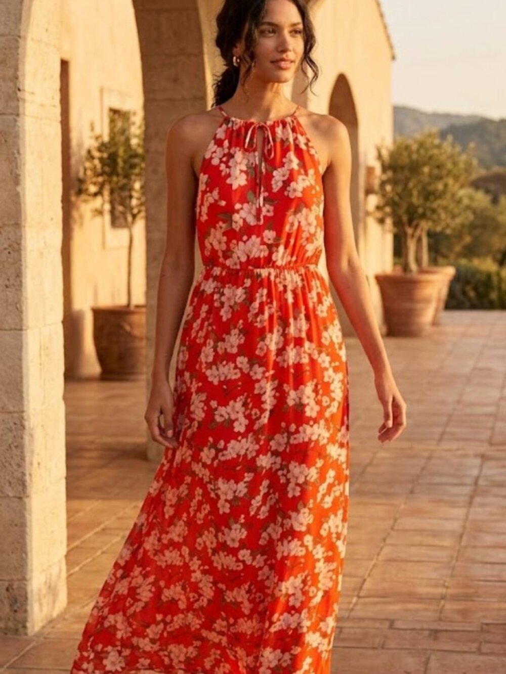 Long, floral/orange,sleeveless,tie-neck  dress.